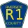 County Road R1 marker