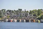 Along the waterline, the two-story floating homes of Roanoke Reef, seen here from Gas Works Park, have replaced the more modest structures in the previous image.
