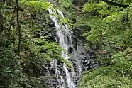 An image of the waterfall from The Roaring Brook Falls trail in Cheshire Connecticut, USA. The image was taken in early August 2021.