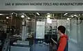 A prospective student looks at a machine tools laboratory.