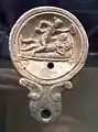 Sexual scene on an oil lamp