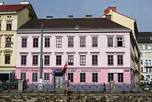 A large pink and white house.