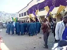 Royal horn blowers and hunters before the palace of the Chief of Kagoro.