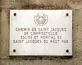 Plaque on the façade of the church stating that it is on the road to Saint Jacques de Compostela
