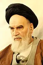 Ayatollah Khomeini, bearded and wearing religious headgear