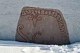 Runestone immured in the church porch
