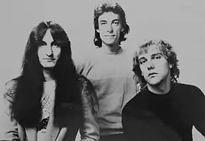 Rush promotional image with Lee, Peart, and Lifeson, left to right