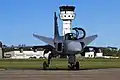 A Saab JAS 39 Gripen and the control tower