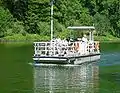 The ferry ship Welles transports passengers across the Saar near the Saarschleife.