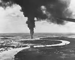 Saigon afire after aerial attacks from carrier-based planes of the US Pacific Fleet in 1945