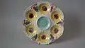 Oyster plate, 9.6 ins., coloured glazes, c. 1881, sunflower pattern.