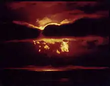 Fireball cloud lights up the clouds in red and yellow, like a sunrise.