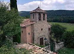Landscape of the Lluçanès with the Sant Agustí de Lluçanès church in the foreground.