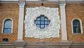 The façade relief surrounding the center window of Santa Cruz Church.