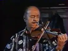 Schnuckenack Reinhardt in performance (still frame from 2000 film by Andreas Öhlers)