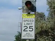 School Zone sign with single flashing beacon in U.S.