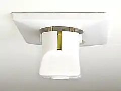 Schuko plug partially inserted in CEE 7/1 non-earthed socket, pins are in contact but exposed.  There is no connection for the earthing contact.