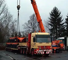 SPMT being loaded on a low-loader by means of a crane