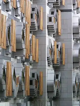 Image 23The Scottish Parliament Building (Scottish Gaelic: Pàrlamaid na h-Alba, Scots: Scots Pairlament Biggin) is the home of the Scottish Parliament at Holyrood, within the UNESCO World Heritage Site in central Edinburgh. It was designed by Enric Miralles, the Catalan architect,.and has won a number of awards, including an award at the VIII Biennial of Spanish Architecture, the RIAS Andrew Doolan Award for Architecture, and the 2005 Stirling Prize, the UK's most prestigious architecture award.Photo credit: Wangi