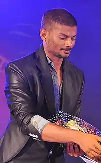 Seezan handing out an award