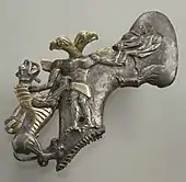 Axe with eagle-headed demon & animals; late 3rd millennium-early 2nd millennium BC; gilt silver; length: 15&nbsp;cm; Metropolitan Museum of Art (New York City)