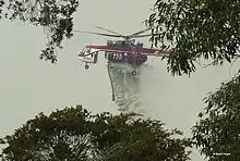 Shania (N720HT), nicknamed Elvis, dropping water during bushfires in the region on 30 April 2007.
