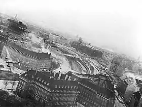 The Gestapo headquarters in the Shellhus, Copenhagen, in March 1945 during Operation Carthage. A Mosquito pulling away from its bombing run is visible on the extreme left, centre