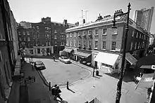 Black and white view of Shepherd Market, London, from an upper storey window