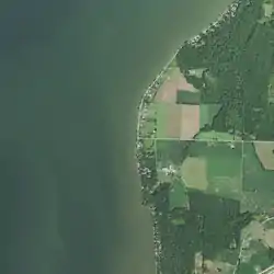 S. Bay Shore Road runs along Green Bay, forming a T intersection with Shoemaker Road