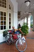 A trishaw and rider at the Raffles Hotel in Singapore.