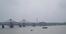 The Sino–Korean Friendship Bridge across the Yalu (Amnokgang) linking Sinuiju and Dandong.
