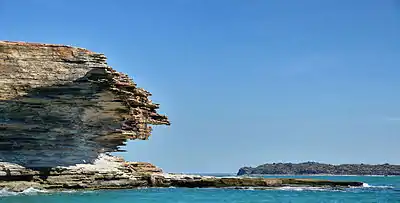 Rock formations on a small island within the group