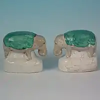 Small staffordshire pottery figures of elephants 2.4ins tall, circa 1860.