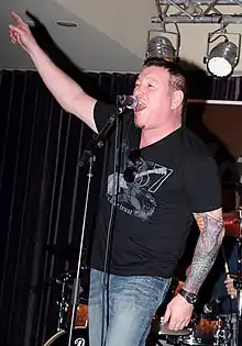 Harwell performing with Smash Mouth in 2013