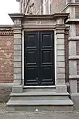Door between a pair of Doric pilasters, in Enkhuizen (the Netherlands)