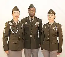 US Army soldiers wearing green and tan uniforms