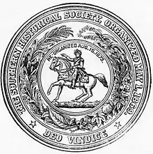 Circular seal with the motto: "The Southern Historical Society, Organized May 1, 1869; Deo Vindice" The central device is a man on a horse, with the text "Re-organized Aug.15.1873.", surrounded by a wreath of assorted plants.