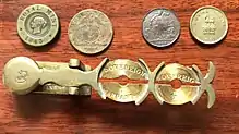 A metal balance with slots