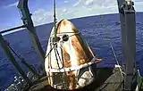 SpaceX’s Crew Dragon Demo-1 spacecraft aboard the company’s recovery vessel, GO Searcher, following splashdown at 8:45 a.m. EST on March 8, 2019.