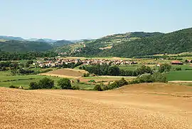 View of the town of Montaigut-le-Blanc with the village of St. Julien in the background and Montaigut-le-Blanc dominated by its castle on the hill in the background