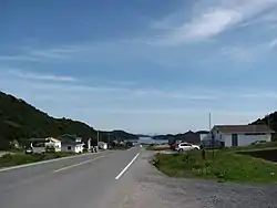Main Street in St. Lunaire-Griquet, with White Cape Harbour in the distance