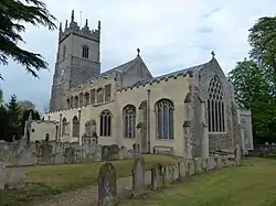 A stone church with a Gothic tower