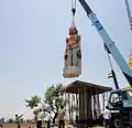 Idol being moved into position