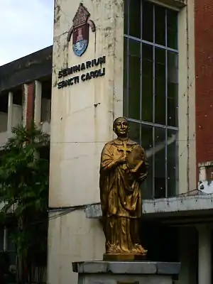The statue of Saint Charles Borromeo in front of the San Carlos Seminary, Makati, Philippines.
