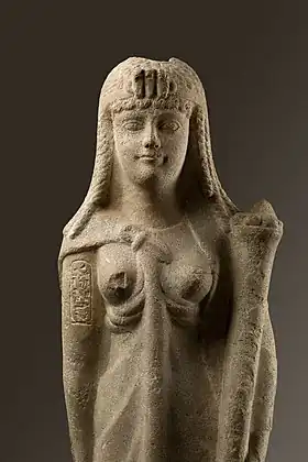 A marble statue of Cleopatra with her cartouche inscribed on the upper right arm and wearing a diadem with a triple uraeus, from the Metropolitan Museum of Art