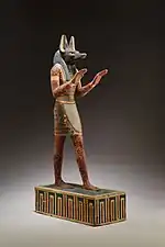 Statuette of Anubis; 332–30&nbsp;BC; plastered and painted wood; 42.3&nbsp;cm; Metropolitan Museum of Art