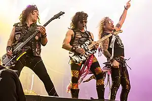 Steel Panther at Rockharz Open Air 2022. Left to right: Spyder, Satchel and Michael Starr
