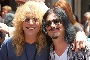 Adler (left) with Gilby Clarke in July 2012