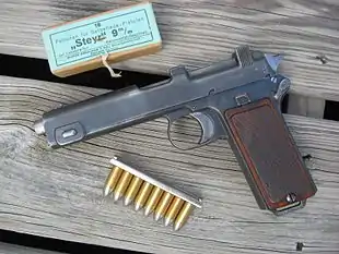 Steyr M1912 pistol with box and stripper clip of 9×23mm Steyr ammunition