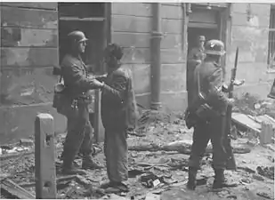 NARA copy #14Jews pulled from a bunker (reportedly  from Nowolipie / Smocza intersection)